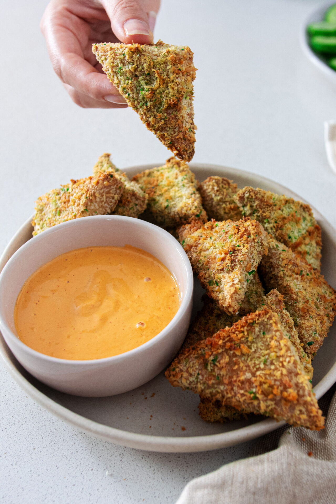 Bowl of Wasabi Panko Bites next to dipping sauce