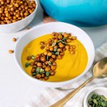 Roasted carrot soup with chickpea croutons - a healthy and budget-friendly meal option.