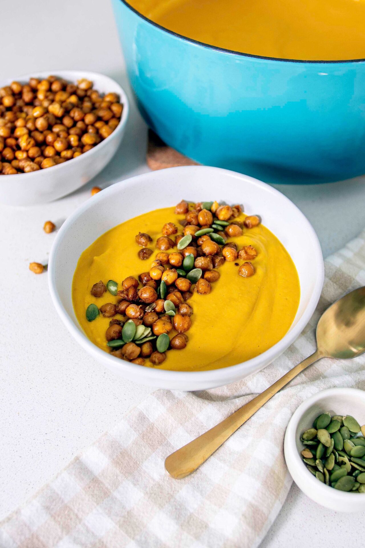 Roasted carrot soup with chickpea croutons - a healthy and budget-friendly meal option.
