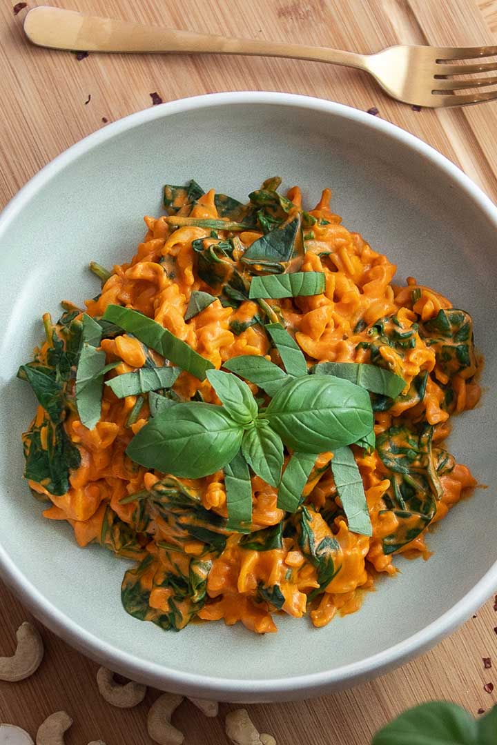 Creamy capsicum pasta with fresh herbs.