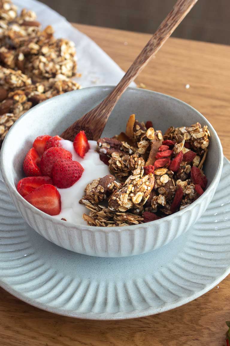 Oil-free vegan granola with oats, nuts, seeds, and dried fruits.
