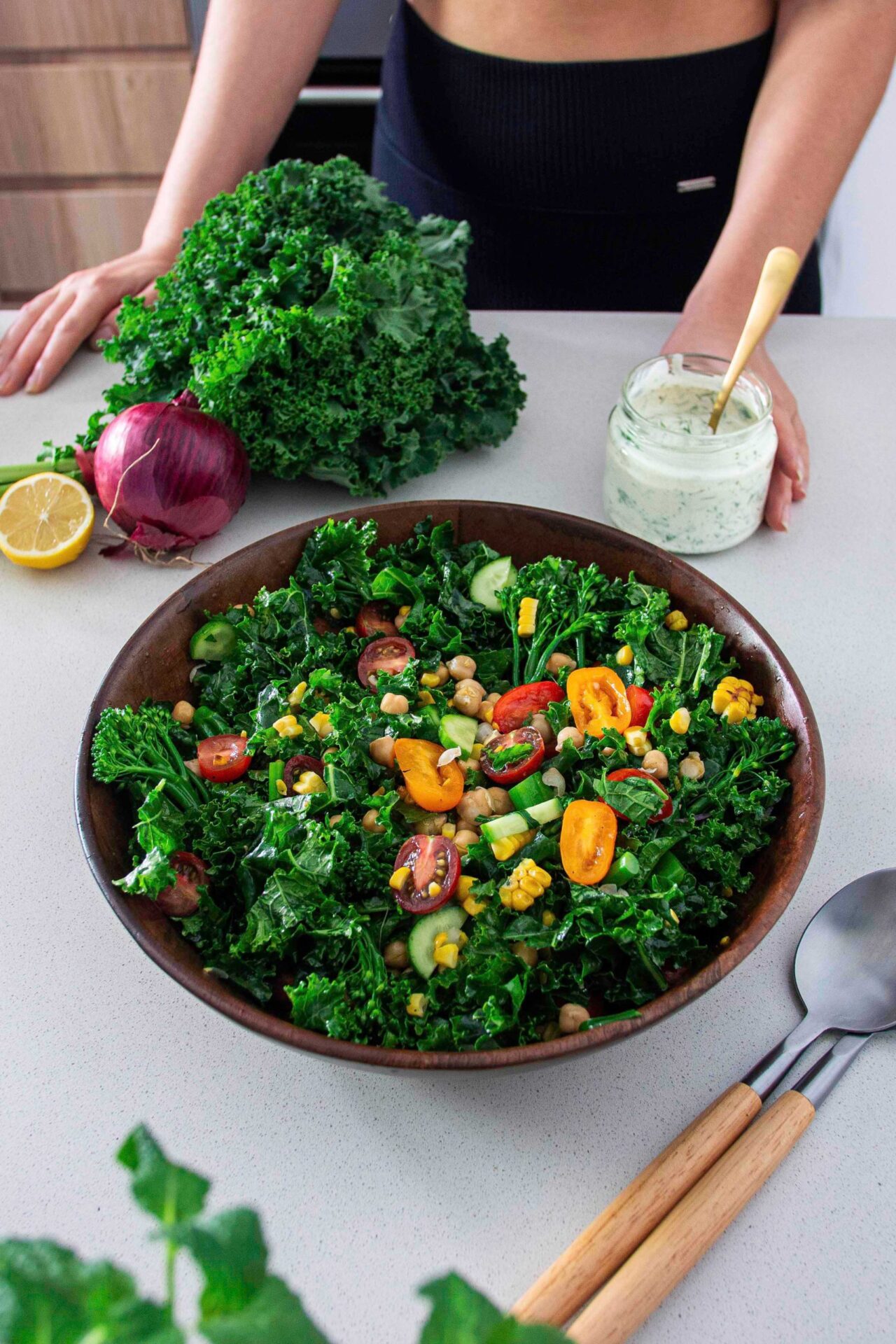 Big salad bowl of Kale Chickpea Salad with healthy ranch dressing