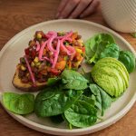 Mexican Stuffed Sweet Potato on a bowl with avocado