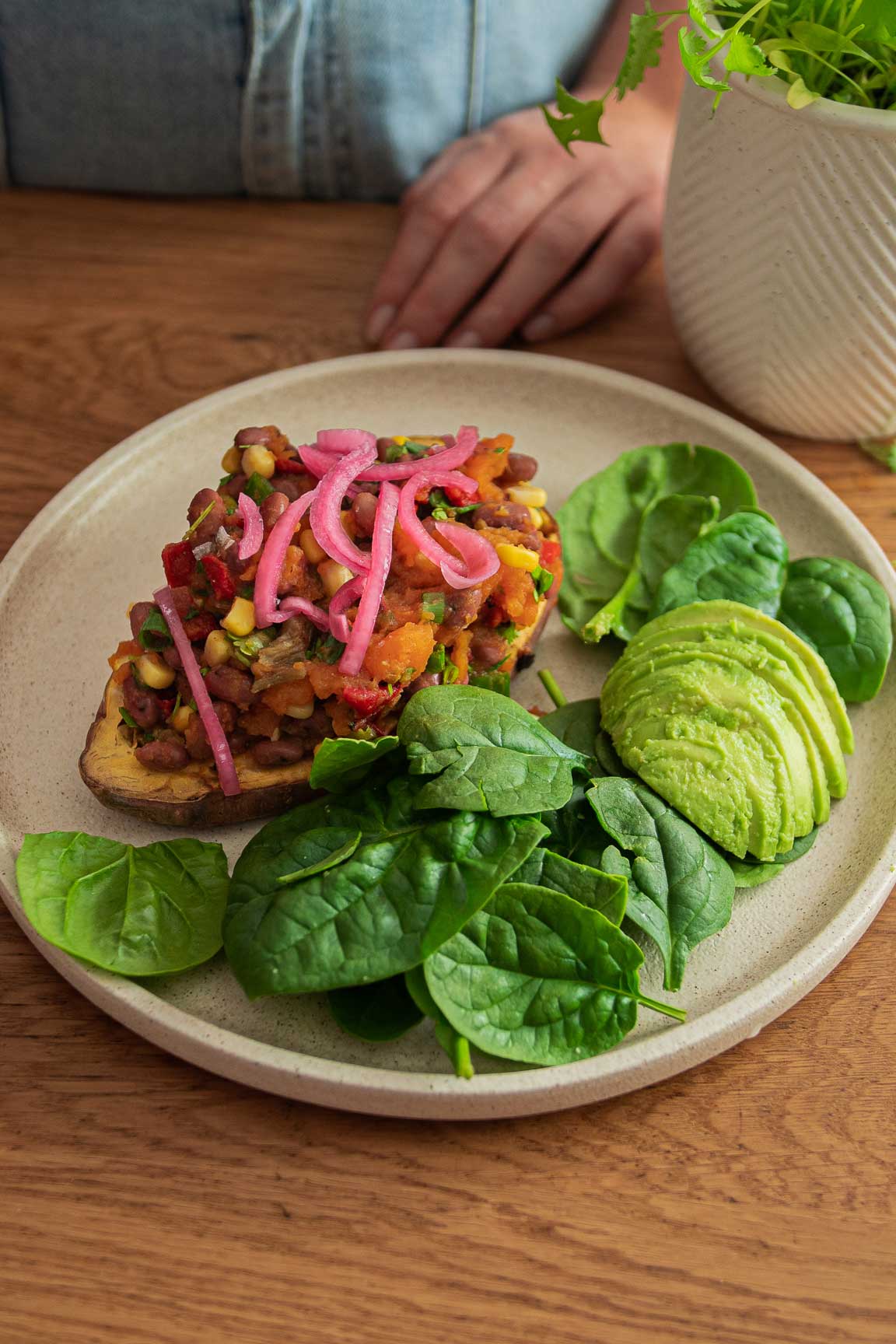 Mexican Stuffed Sweet Potato on a bowl with avocado