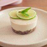 Dairy-free vegan mojito cheesecake with lime and mint toppings