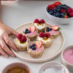 No-bake oat yogurt cups with a creamy yogurt filling topped with fresh berries