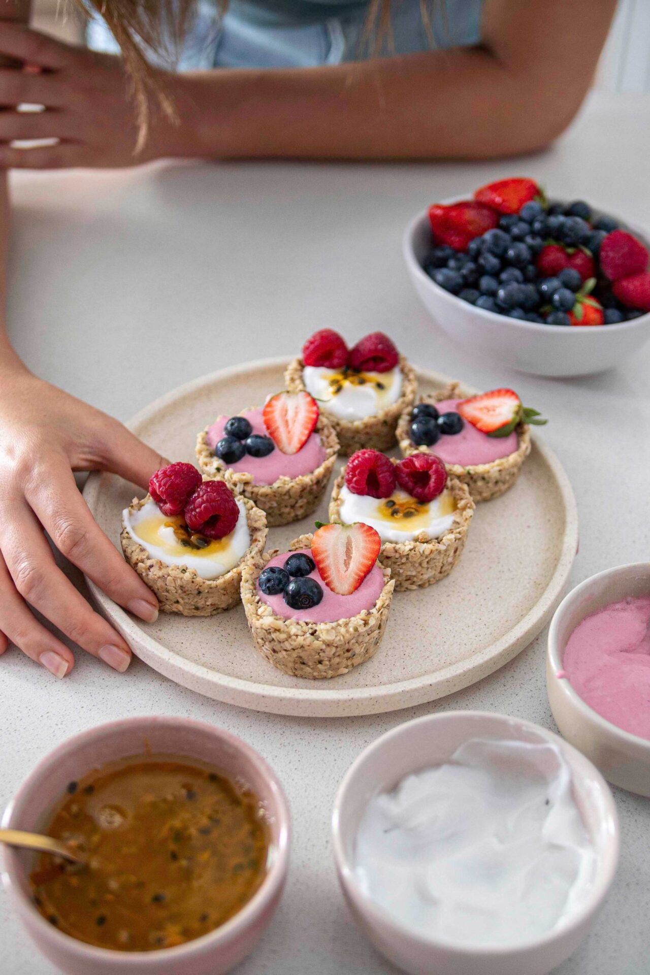 No-bake oat yogurt cups with a creamy yogurt filling topped with fresh berries