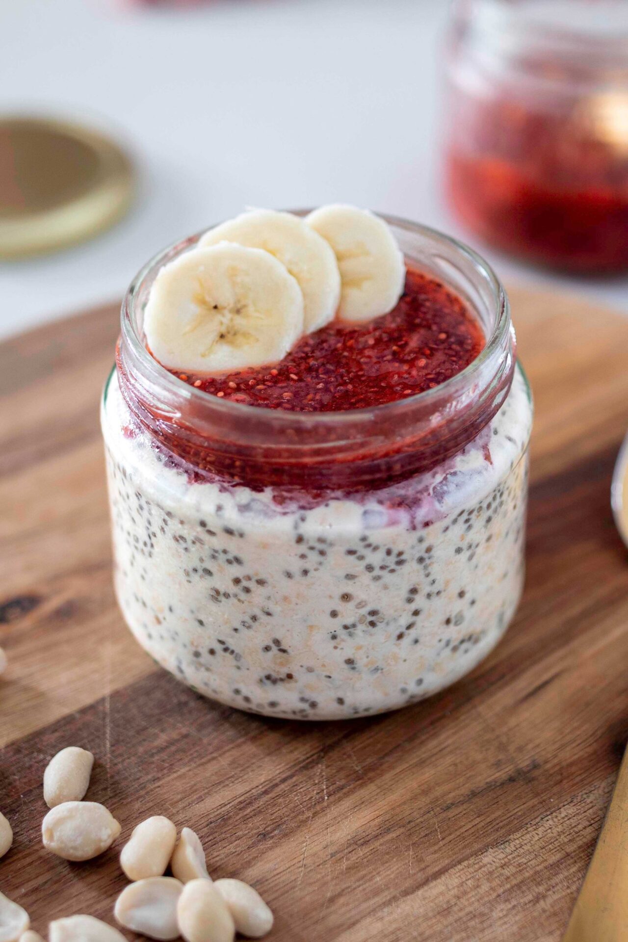 Healthy Peanut Butter and Jam Overnight Oats in a Jar with Diced Banana