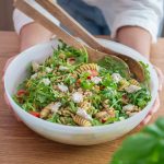 Big salad bowl, full of pesto pasta salad