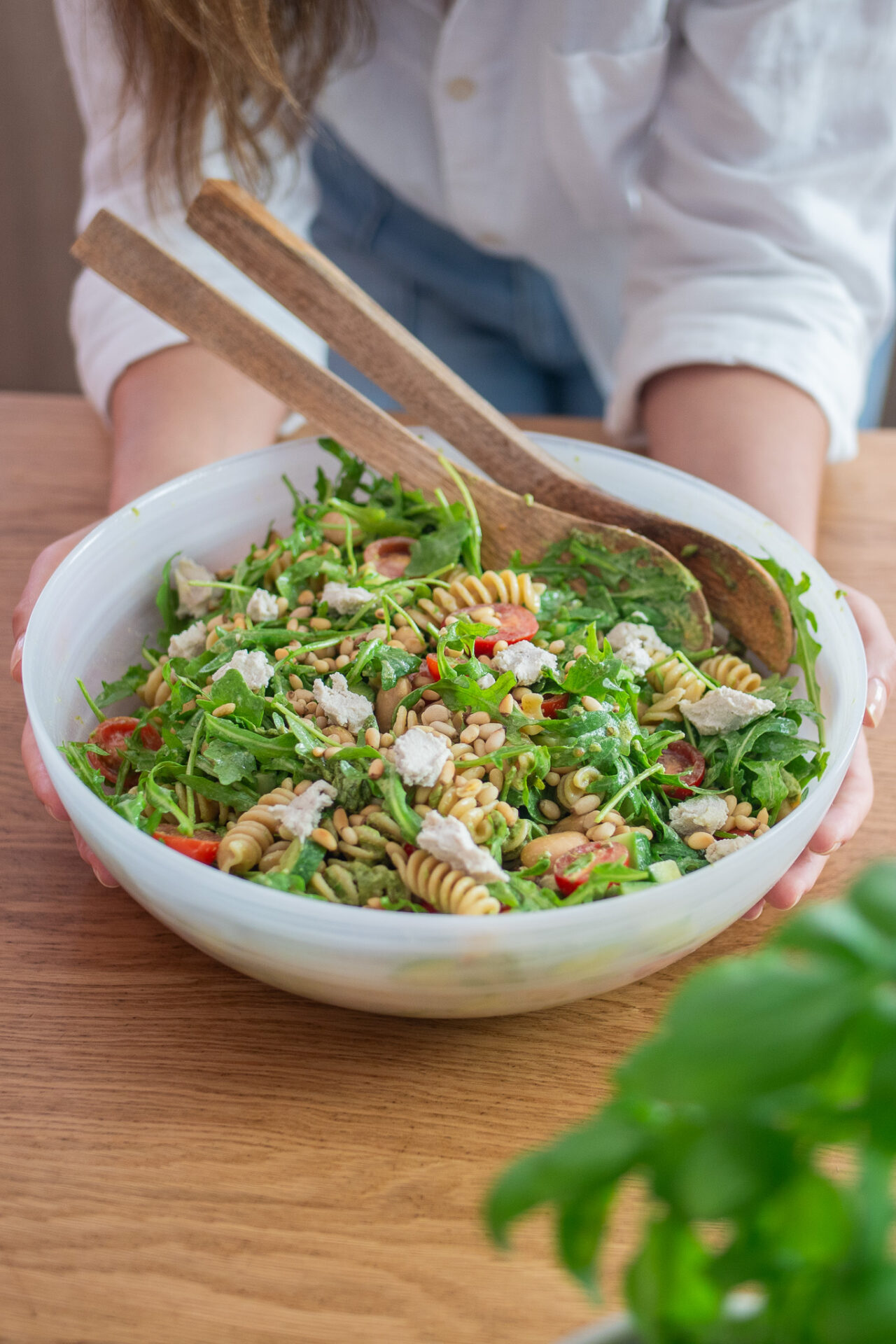 Big salad bowl, full of pesto pasta salad