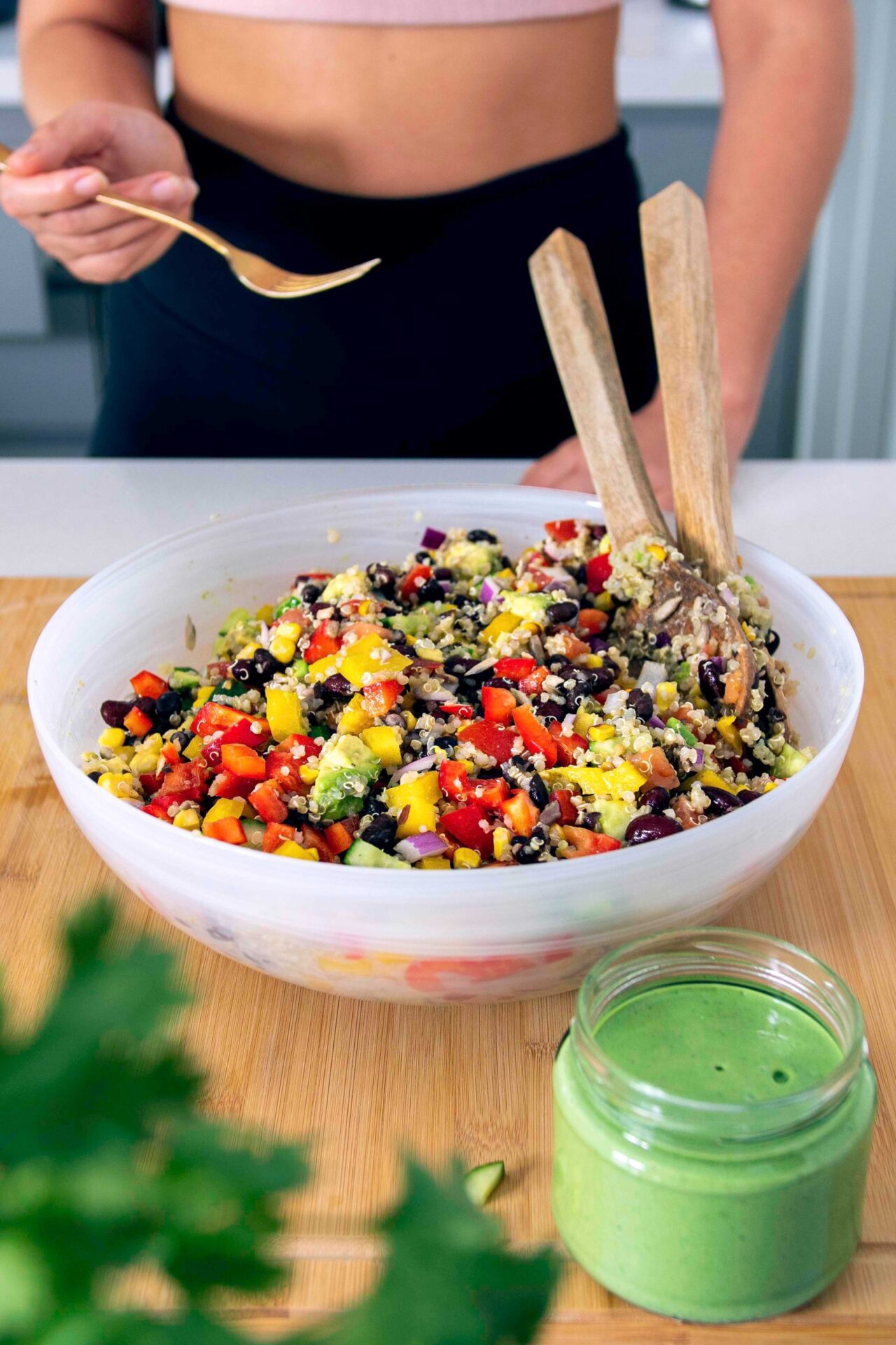 Colorful and nutritious rainbow quinoa salad with a variety of fresh vegetables and a tangy dressing.