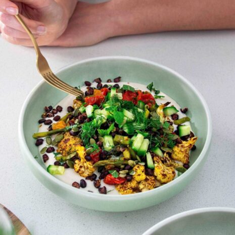 Roasted cauliflower, asparagus, and adzuki beans served with a creamy, flavorful garlic white bean sauce.