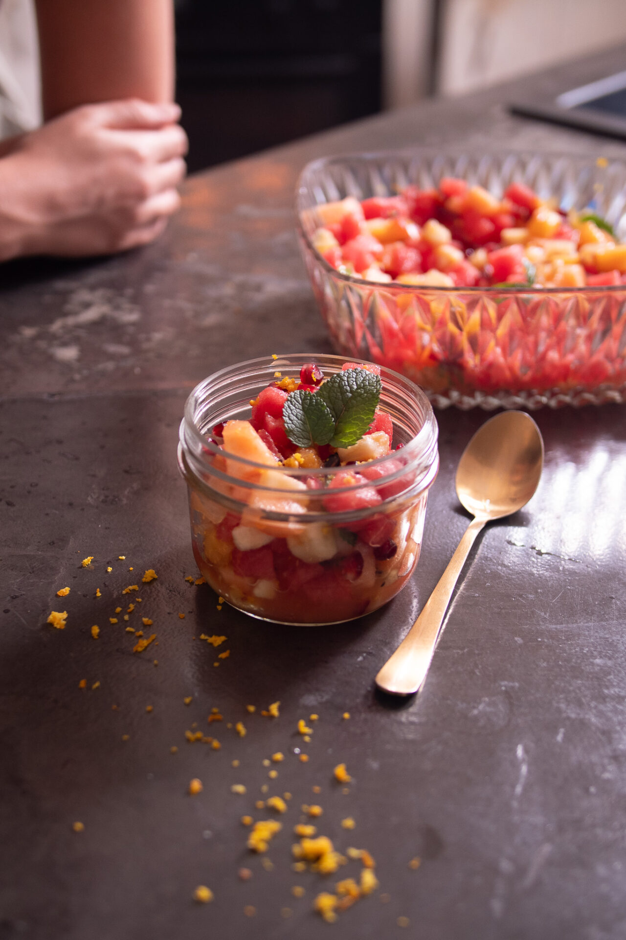 Refreshing vibrant jar full of colourful summer fruit salad
