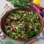Roasted asparagus beetroot and butter bean salad in a wooden salad bowl