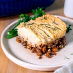 Savory Shepherd's Pie topped with creamy mashed potatoes and baked to perfection