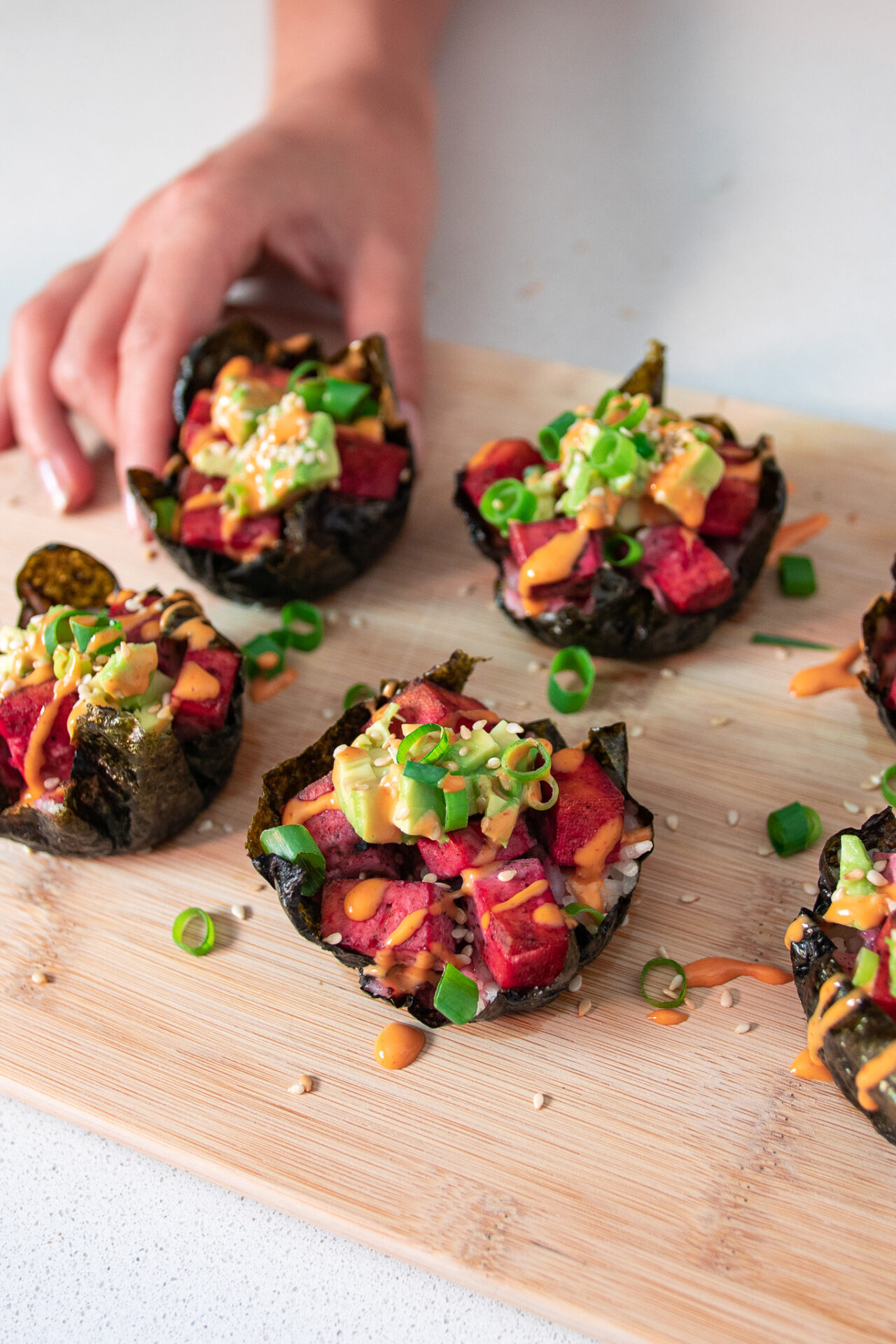 Viral spicy tofu, sushi muffins on a serving board