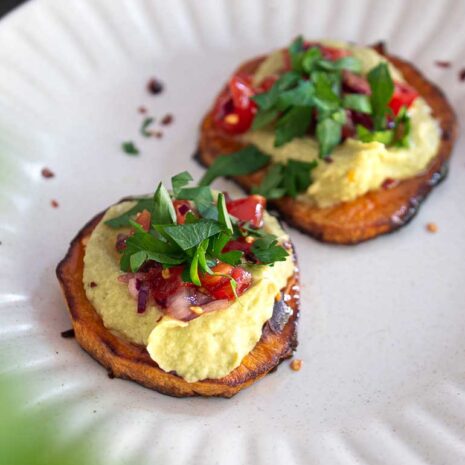 Avocado hummus spread on slices of sweet potato toast.