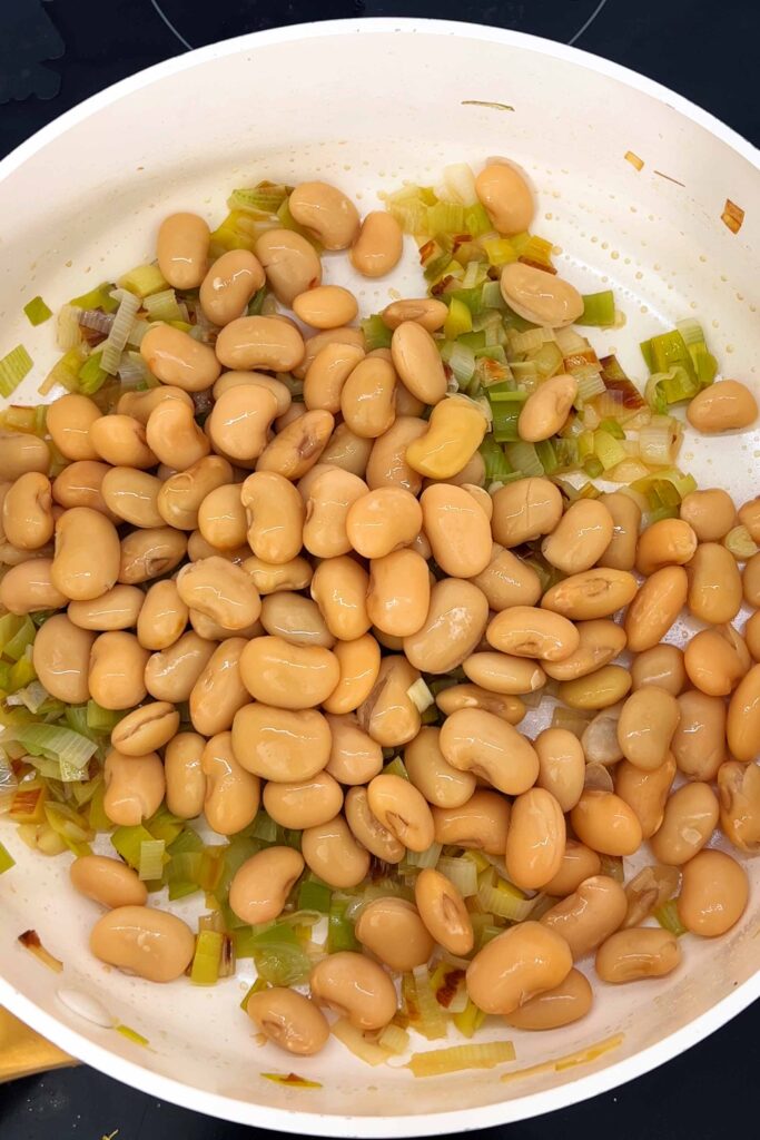 Pot of caramelized leek and butter beans