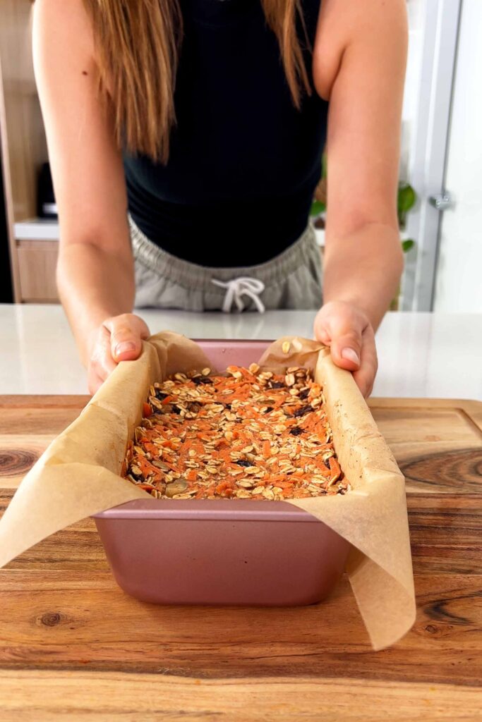 Carrot Cake Baked Oats in a loaf tin lined with parchment paper
