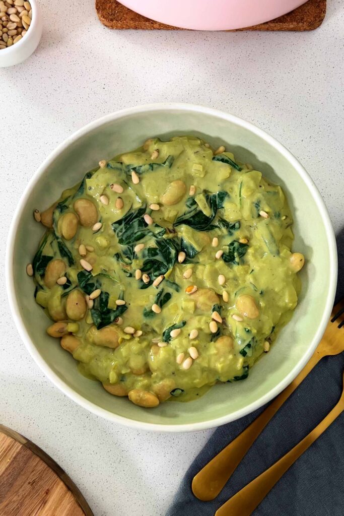 High Protein Butter Bean Pesto bowl with pine nuts sprinkles all over