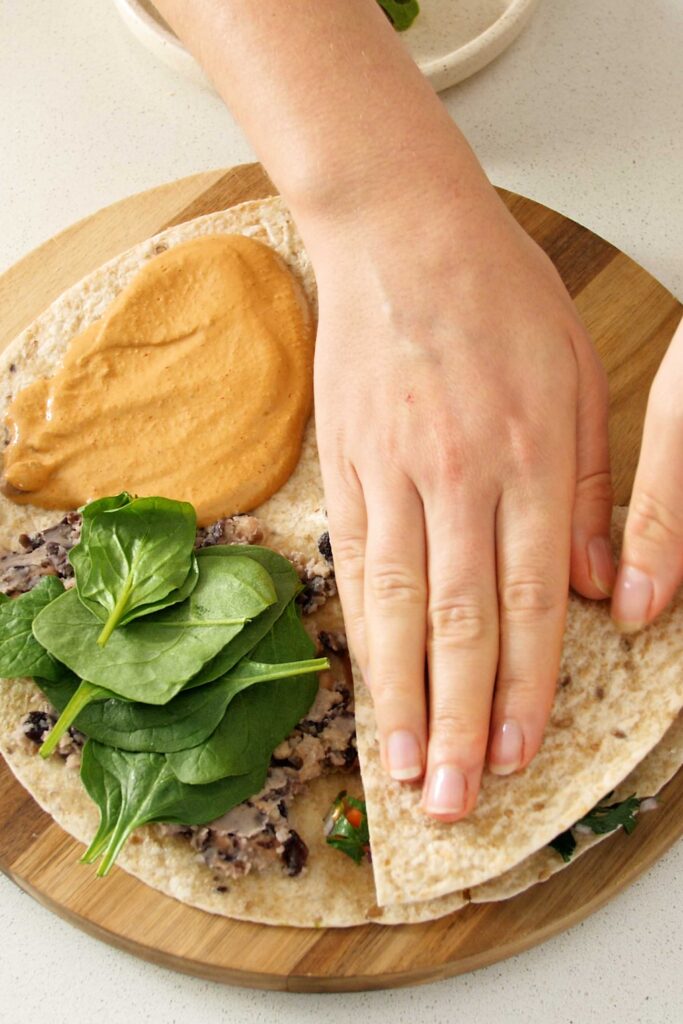 Tortilla being folded quadrant by quadrant