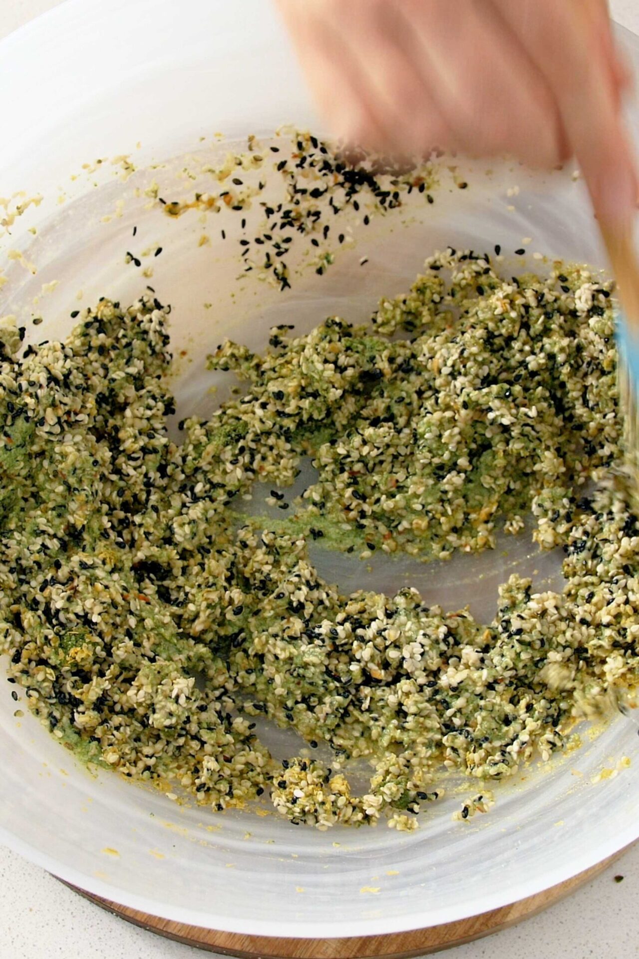 Bowl of crackers mix being thoroughly combined