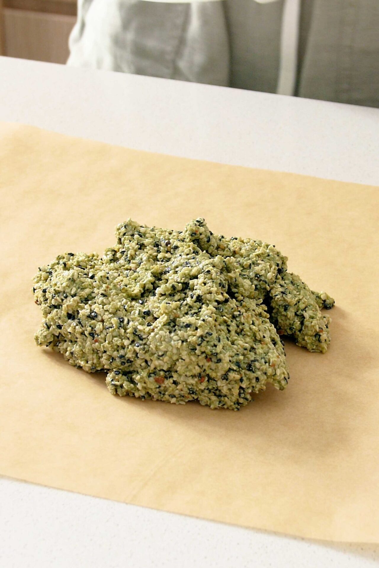 The crackers mix in a mound on a sheet of baking paper