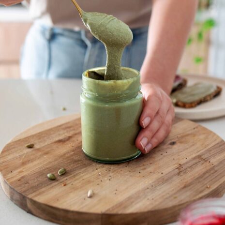 Green nut-free nut butter in a jar made from pumpkin and sunflowers seeds