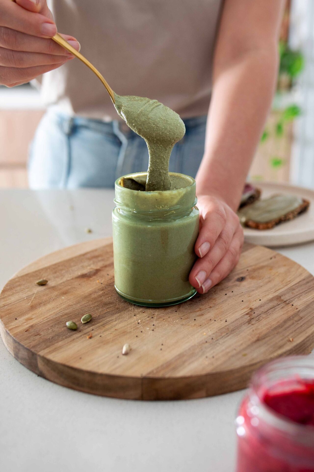 Green nut-free nut butter in a jar made from pumpkin and sunflowers seeds