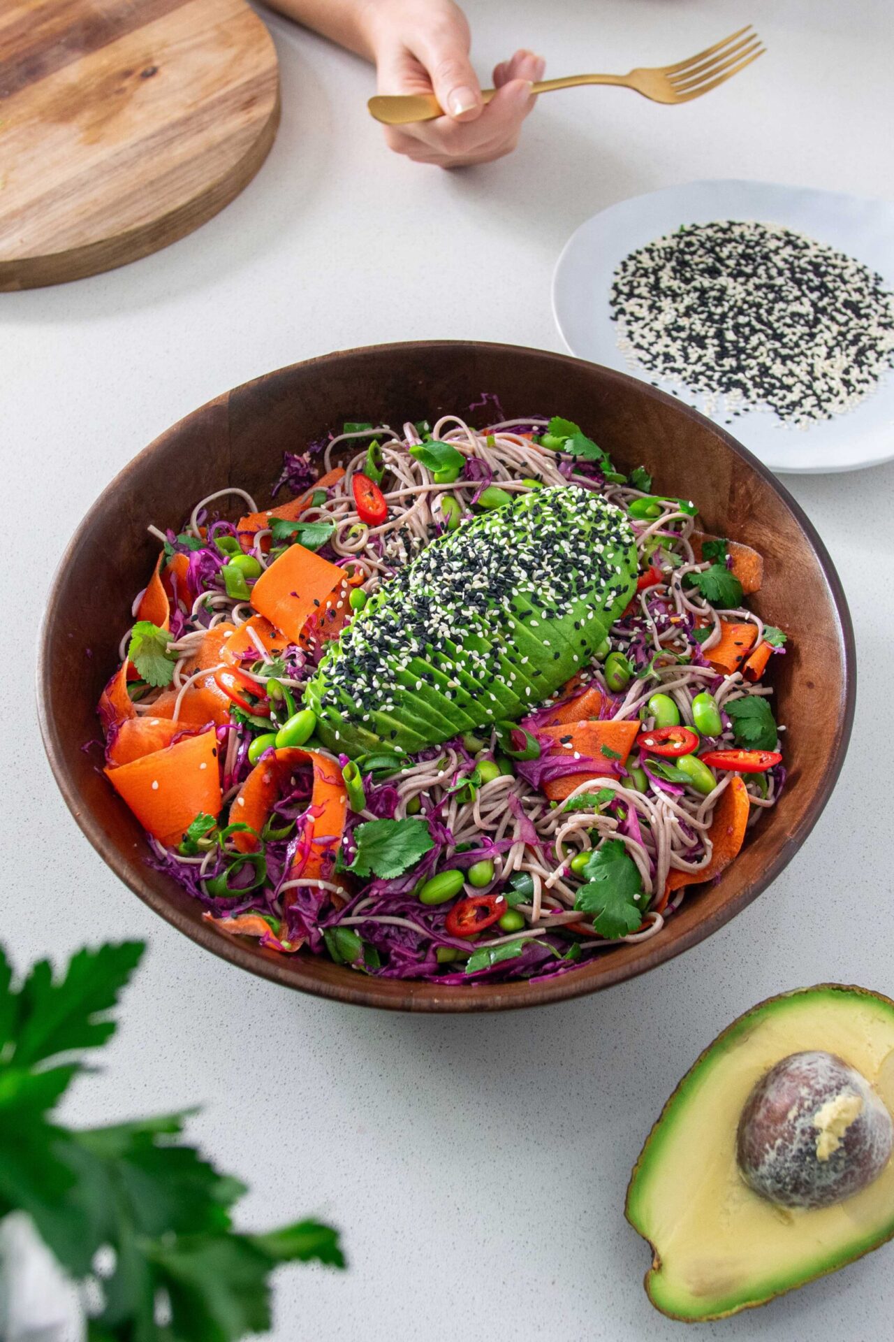 vibrant salad bowl with avocado, carrot and colorful veggies