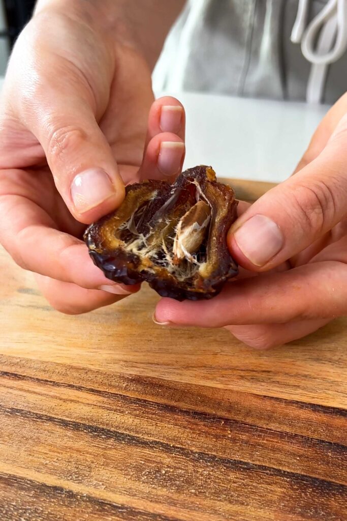 Sarah holding Medjool Date cut in half
