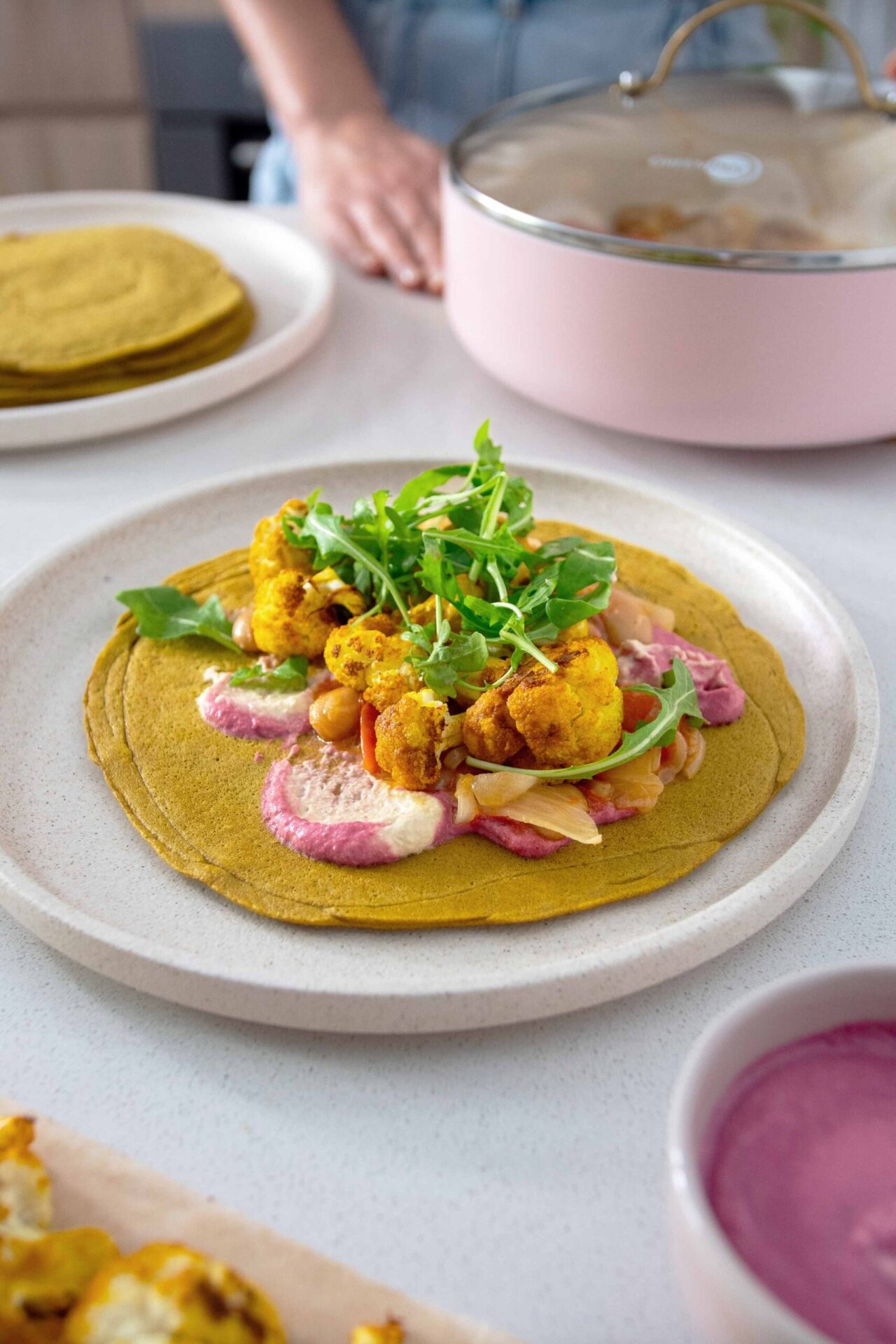 Turmeric Quinoa Wraps with beetroot hummus and roasted cauliflower toppings