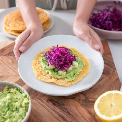 Sarah holding a dish with the Red Lentil Wraps 5 ingredient meal
