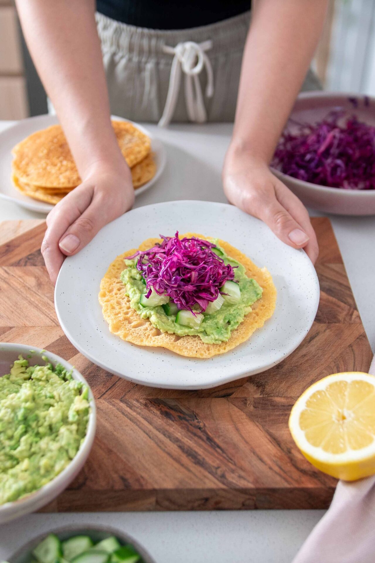 Sarah holding a dish with the Red Lentil Wraps 5 ingredient meal