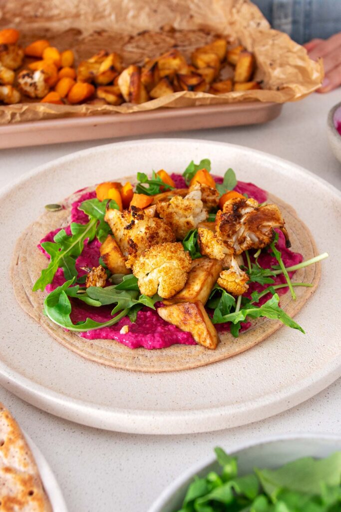 Vibrant, veggies layered on a quinoa and red lentil wrap