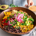 Chopped Southwest Salad ready to eat with a fork and napkin.
