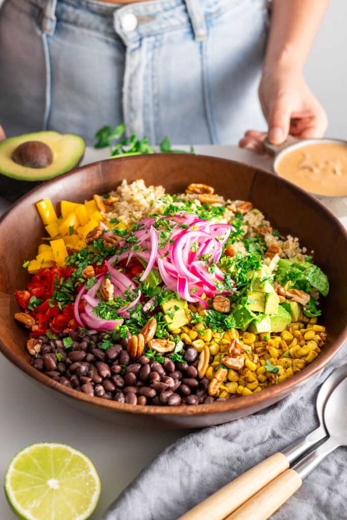 Chopped Southwest Salad ready to eat with a fork and napkin.