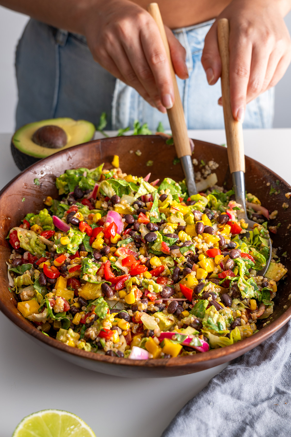 Chopped Southwest Salad tossed and served in a wooden bowl.