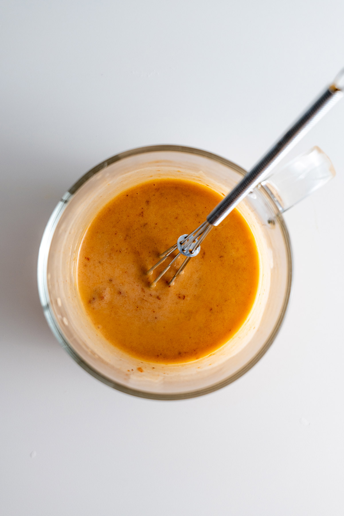 Preparation of Chipotle Dressing for Southwest Salad in a glass bowl.