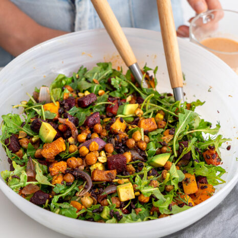 Overhead view of a mixed Harissa Pumpkin Salad with chickpeas and butternut squash