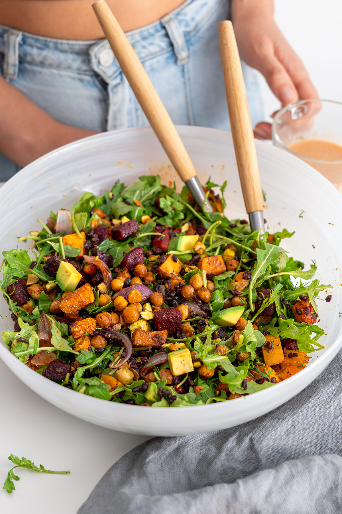 Overhead view of a mixed Harissa Pumpkin Salad with chickpeas and butternut squash