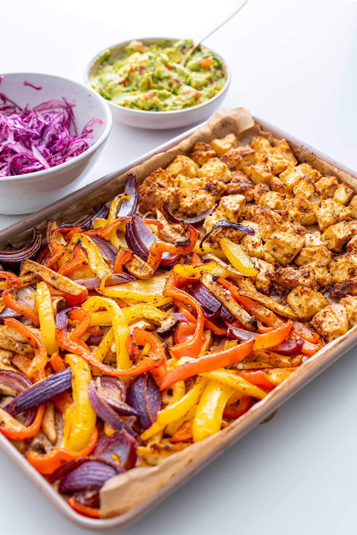 Components for vegan sheet pan fajitas neatly arranged, showcasing the variety of textures and colors.