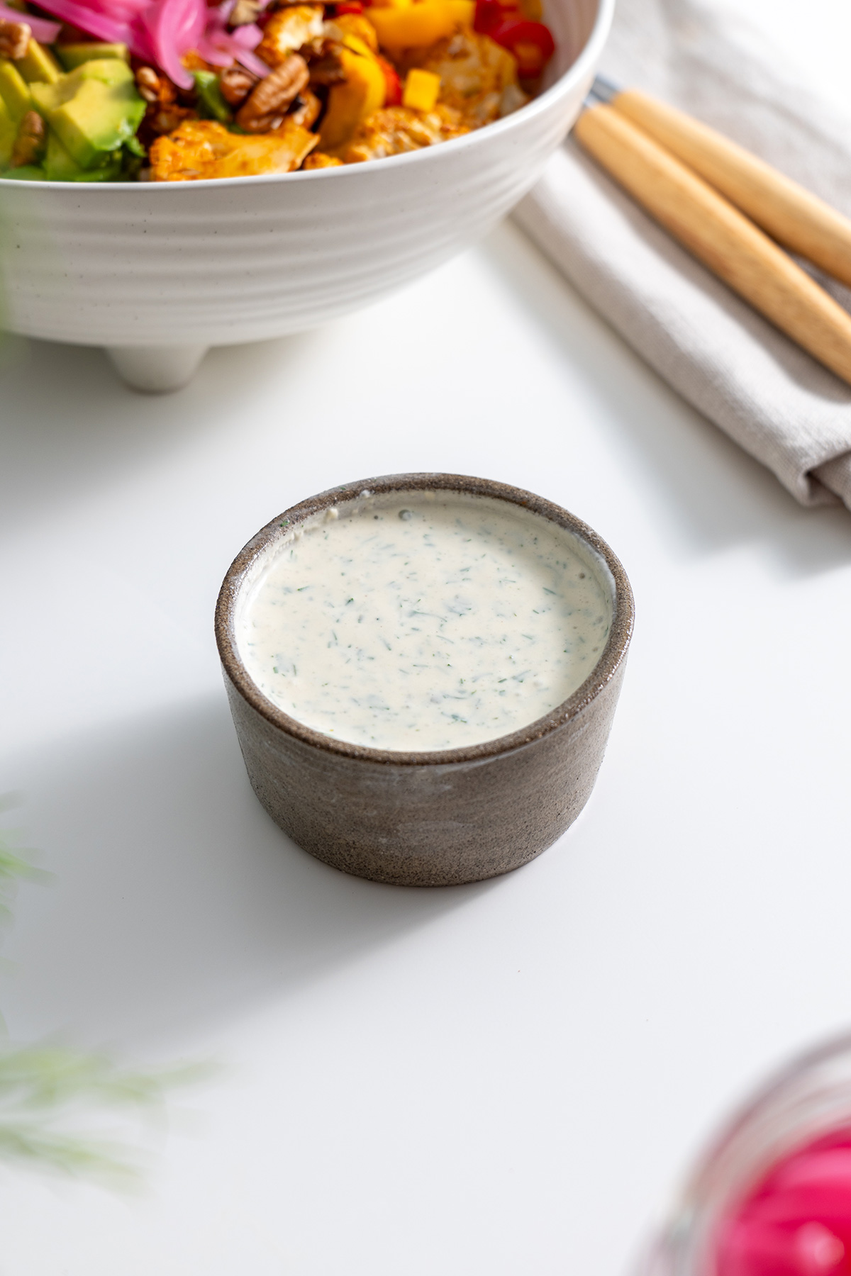 Handcrafted ranch dressing with fresh herbs, ready to complement the buffalo cauliflower salad.