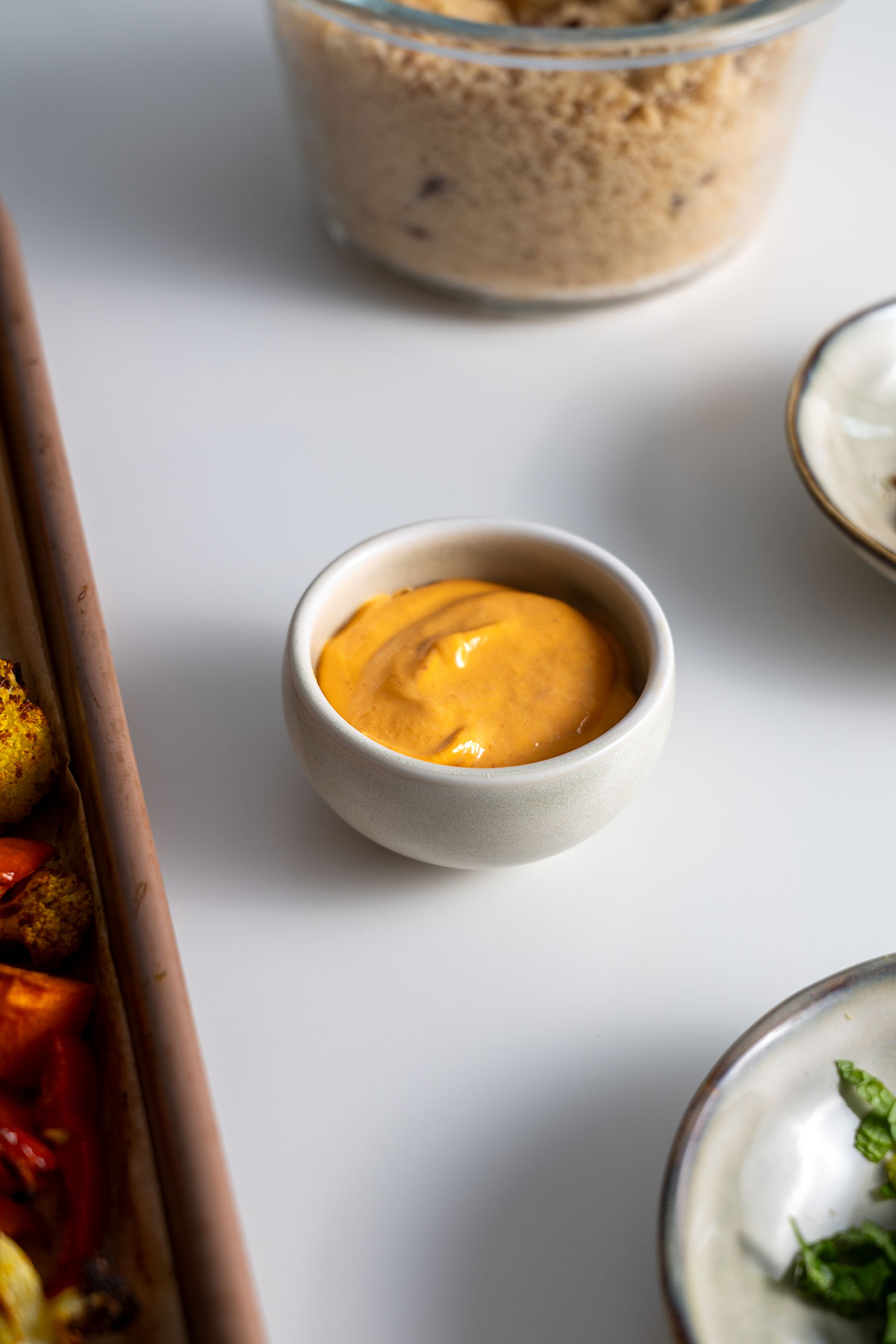 Creamy sauce in a small ceramic bowl.