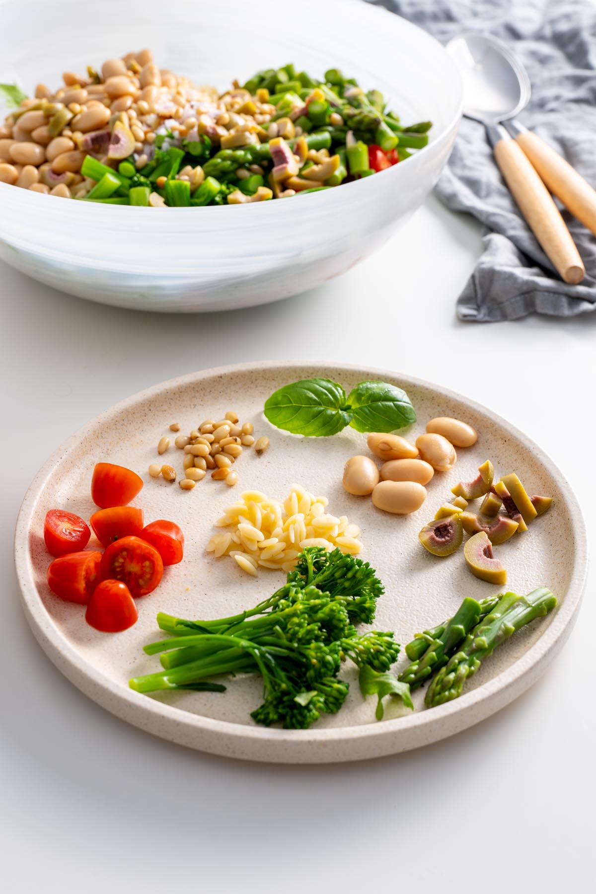 Topping ingredients for a pesto orzo salad