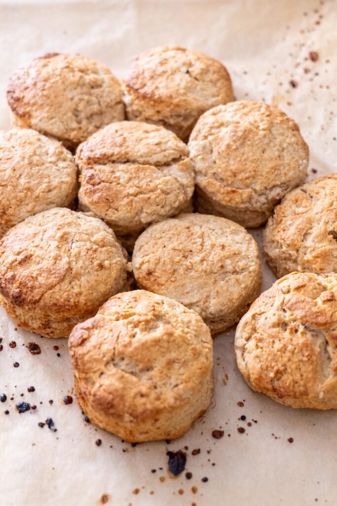 Golden-baked vegan scones on parchment paper.