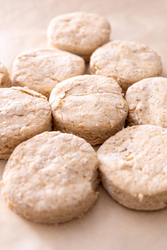 Vegan scones arranged on a baking sheet.