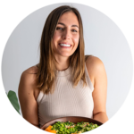 Sarah Cobacho, plant-based nutritionist profile photo holding a vibrant salad whilst smiling