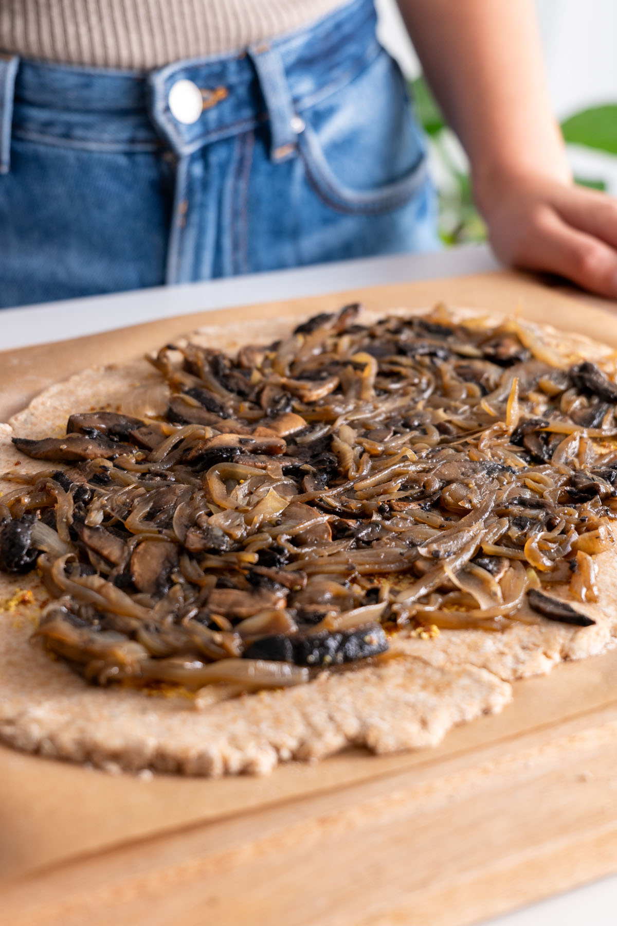 Caramelized onion and mushroom mixture spread on the galette dough before baking.
