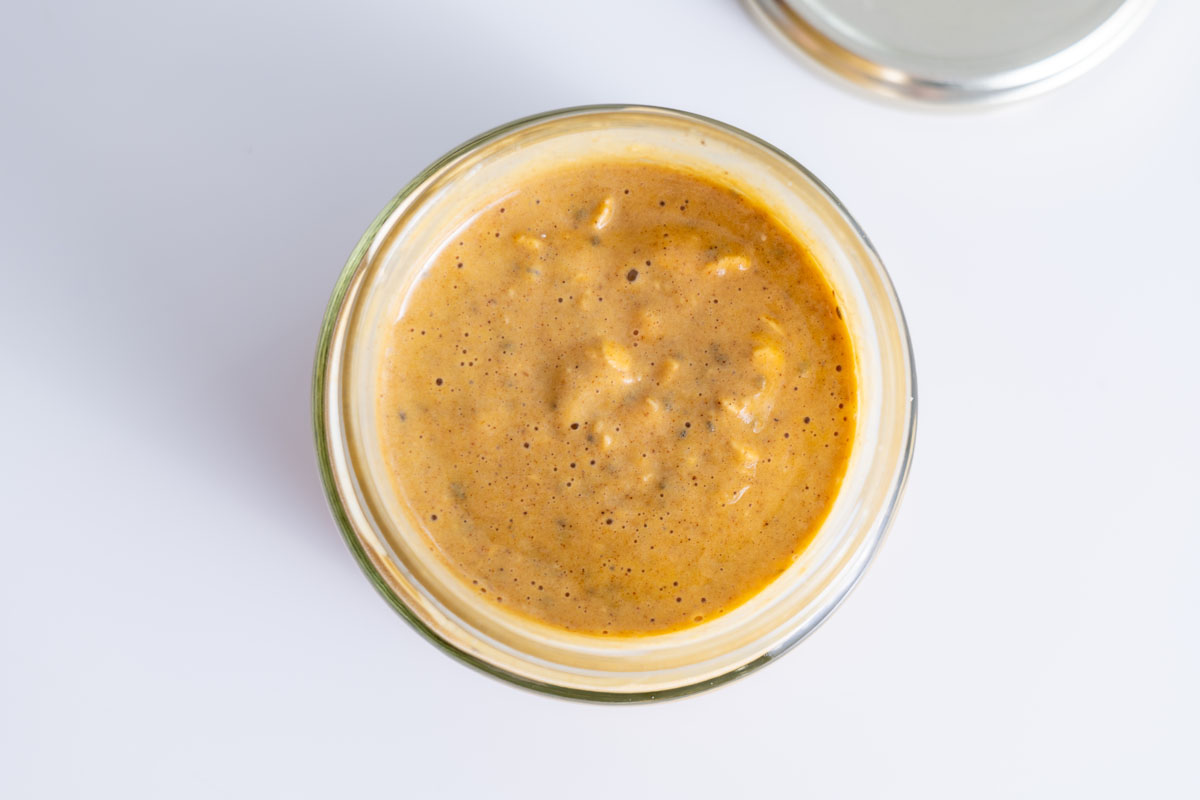 Pumpkin spice overnight oats in a jar before refrigerating.